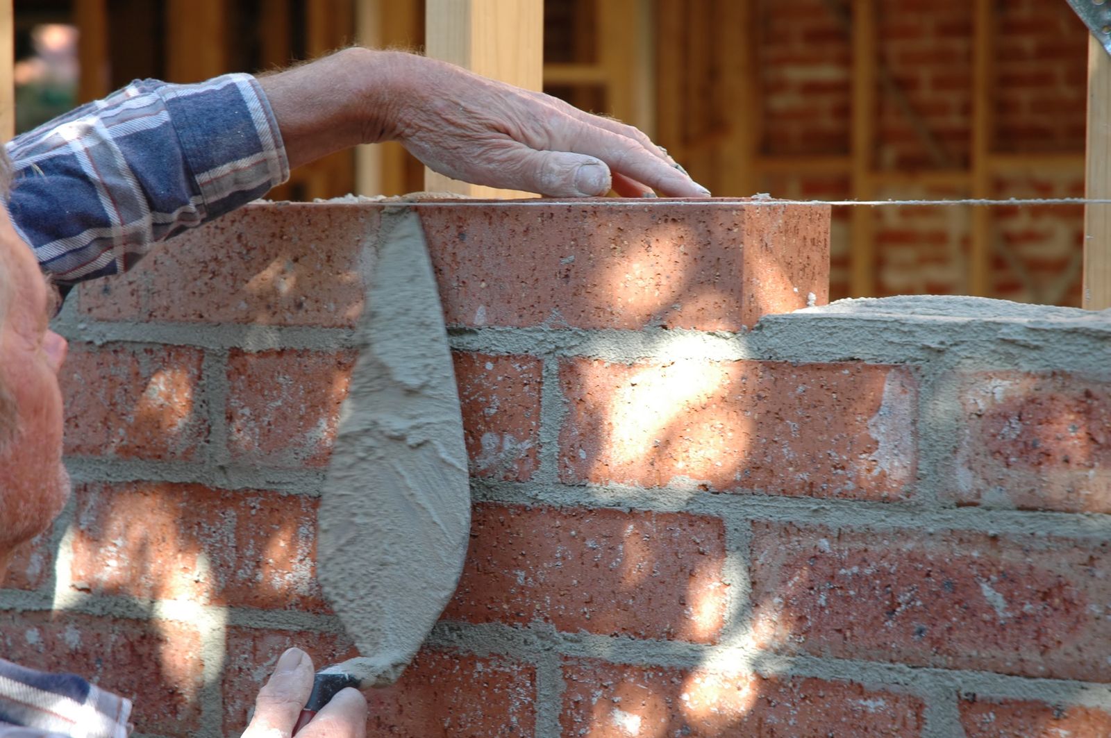 Fresh red brick coursework with tooled joints