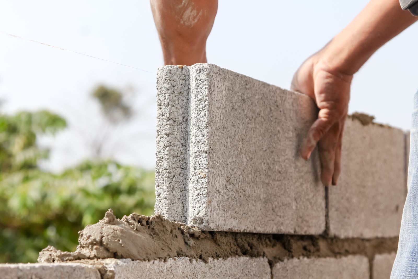 Concrete block retaining wall under construction